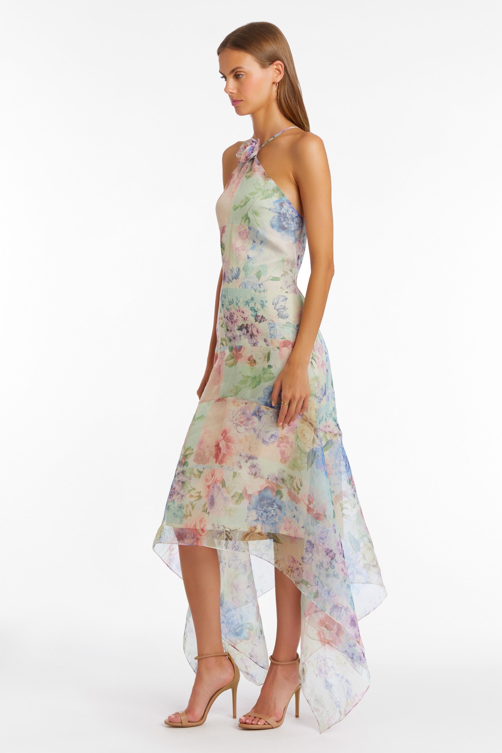 Girl in maxi floral dress, side facing.